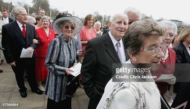 Guests attending the Queen's 80th Birthday Lunch wait for their identification to be checked on April 19, 2006 at Buckingham Palace in London,...