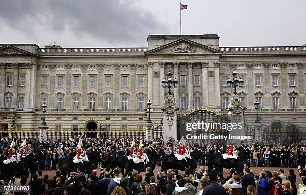 Members of the Queens Guards Household Cavalry ride past Buckingham Palace on April 19, 2006 in London, England. TRH Queen Elizabeth II and Prince...