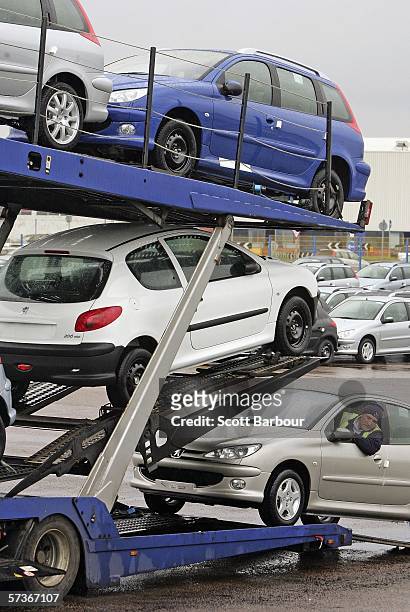 Peugeot cars are driven onto a vehicle transporter at the PSA Peugeot Citroen Ryton plant on April 19, 2006 in Coventry, England. Unions have...