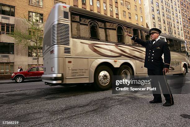 Doorman with the Dakota building who declined to give his name works outside the landmark building April 19, 2006 in New York City. Thousands of New...