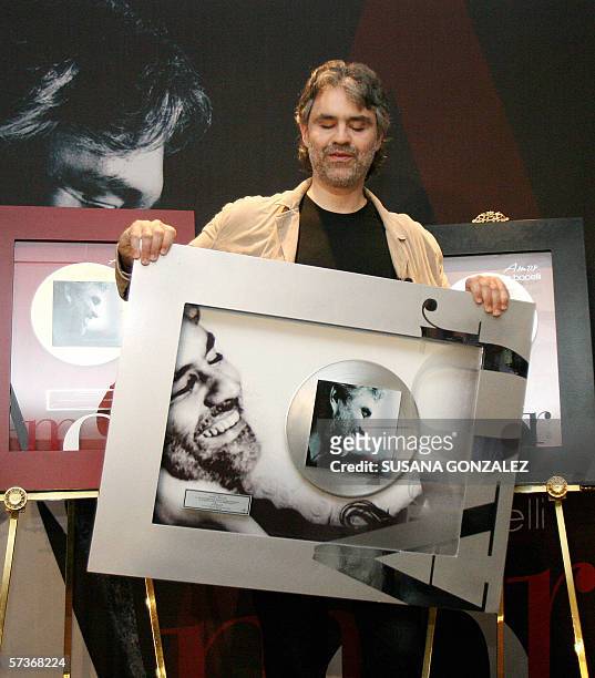 Italian singer Andrea Bocelli, poses during a press conference after receiving a platinum disc for the sales of his new album "Love", 19 April 2006...