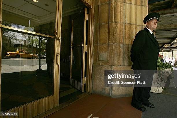 Viorel Pasku, a doorman with a building on Central Park West, works in front of his building April 19, 2006 in New York City. Thousands of New York...