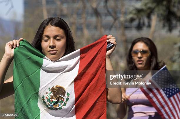 Daisy Gonzales displays a Mexican flag during a rally of about 3,000 middle and high school students who walked out of school April 19, 2006 in...