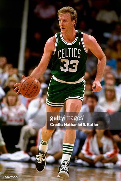 Larry Bird of the Boston Celtics moves the ball up court during a game played in 1990 at the Boston Garden in Boston, Massachusetts. NOTE TO USER:...