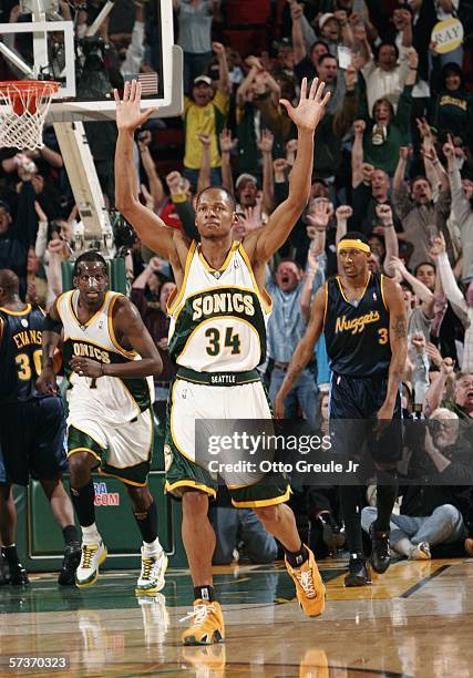 Ray Allen of the Seattle SuperSonics reacts after hitting his sixth three-point shot of the game against the Denver Nuggets, breaking the NBA record...