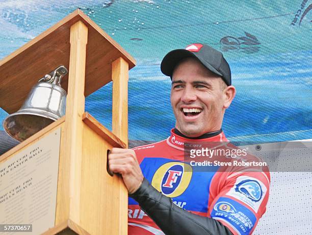 Kelly Slater of the USA celebrates with the trophy after his victory in the Rip Curl Pro on April 20, 2006 at Bells Beach, Australia.