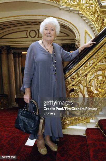 Elizabeth Morris stands on the Grand Staircase of Buckingham Palace at an 80th birthday lunch April 19, 2006 in London, England. The lunch is held by...