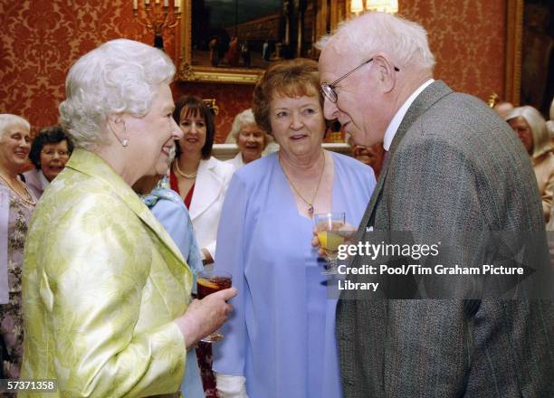 Queen Elizabeth II meets Allan Garrioch and his wife Helen at an 80th birthday lunch April 19, 2006 in London, England. The lunch is held by The...