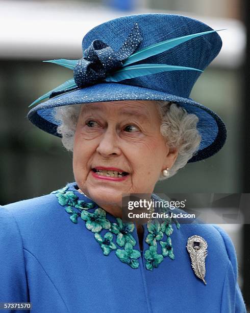 Queen Elizabeth II meets school children as she leaves BBC Broadcasting House to mark the anniversary of the granting of the Corporation's Royal...