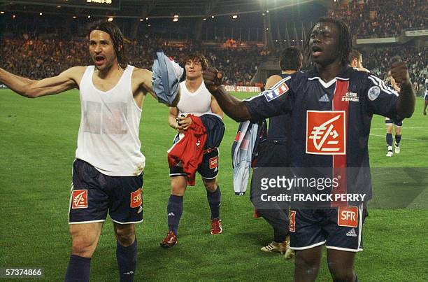 Paris' defender Sylvain Armand and his teammate Cameroonian midfielder Modeste Mbami celebrate after their French cup semi final football match...
