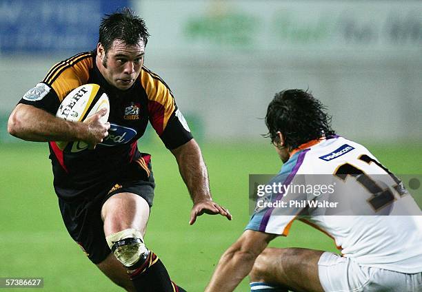 Anthony Tahana of the Chiefs looks to fend off Gaffie Du Toit of the Cheetahs during the Round 11 Super 14 match between the Chiefs and the Cheetahs...