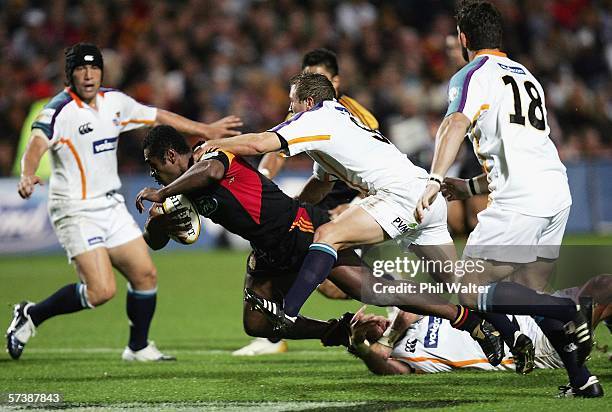Sitiveni Sivivatu of the Chiefs is tackled by Falie Oelschig of the Cheetahs during the Round 11 Super 14 match between the Chiefs and the Cheetahs...