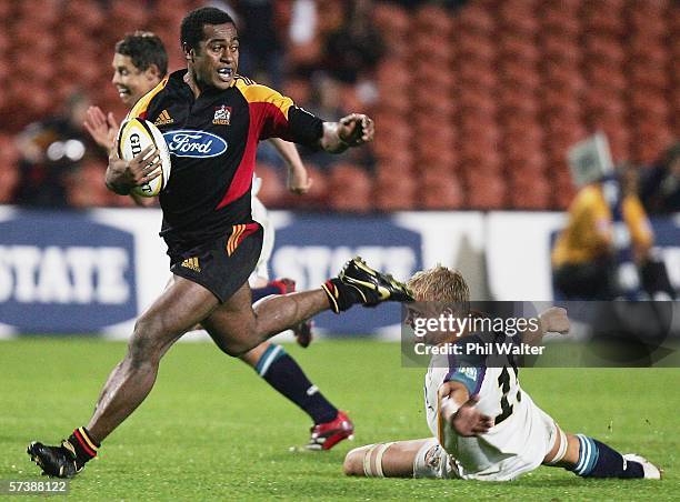 Sitiveni Sivivatu of the Chiefs evades the tackle of Gareth Krause of the Cheetahs during the Round 11 Super 14 match between the Chiefs and the...