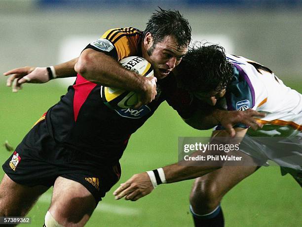 Anthony Tahana of the Chiefs is tackled by Bevin Fortuin of the Cheetahs during the Round 11 Super 14 match between the Chiefs and the Cheetahs at...
