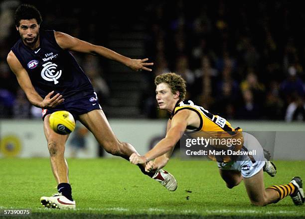 Setanta O"Hailpin for the Blues and Zac Dawson for the Hawks contest the ball during the round four AFL match between the Carlton Blues and the...