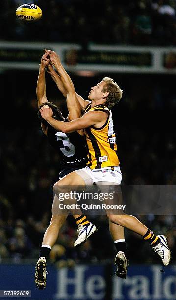 Michael Osborne for Hawthorn contests the ball with Marc Murphy for Carlton during the round four AFL match between the Carlton Blues and the...