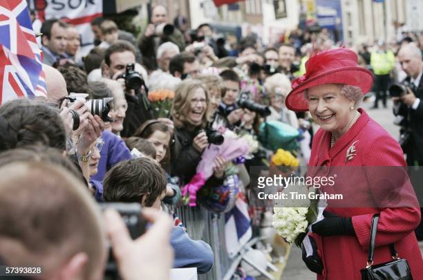 Queen Elizabeth II smiles at the crowds on April 21, 2006 in Windsor, England. HRH Queen Elizabeth II is taking part in her traditional walk in the...