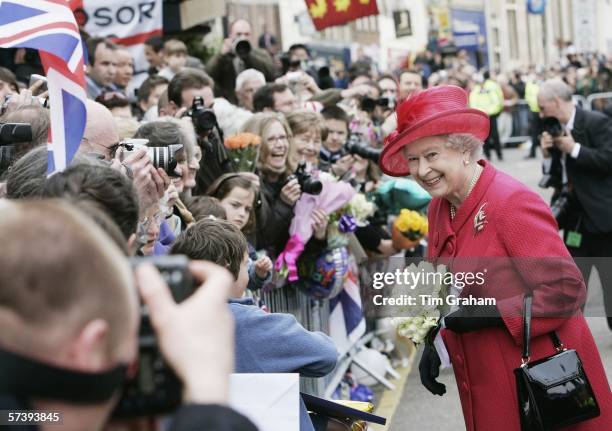 Queen Elizabeth II smiles at the crowds on April 21, 2006 in Windsor, England. HRH Queen Elizabeth II is taking part in her traditional walk in the...