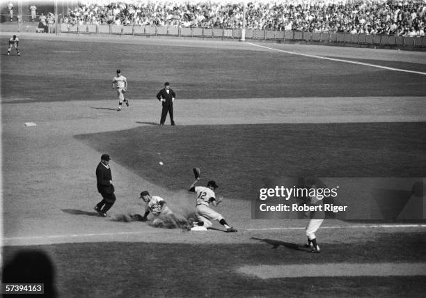 American baseball player Maury Wills of the Los Angeles Dodgers slides into third base as he steals in 104th base for the season during the third...