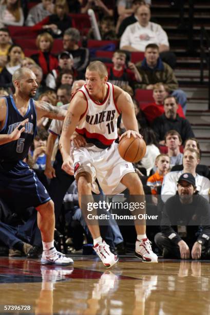 Joel Przybilla of the Portland Trail Blazers posts up against Carlos Boozer of the Utah Jazz on April 1, 2006 at the Rose Garden in Portland, Oregon....