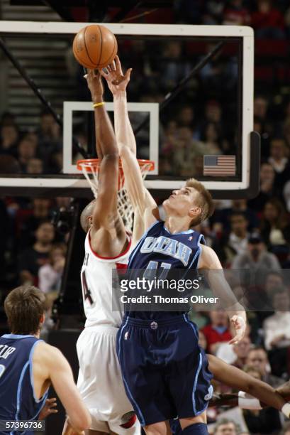 Andrei Kirilenko of the Utah Jazz and Brian Skinner of the Portland Trail Blazers battle for the ball on April 1, 2006 at the Rose Garden in...