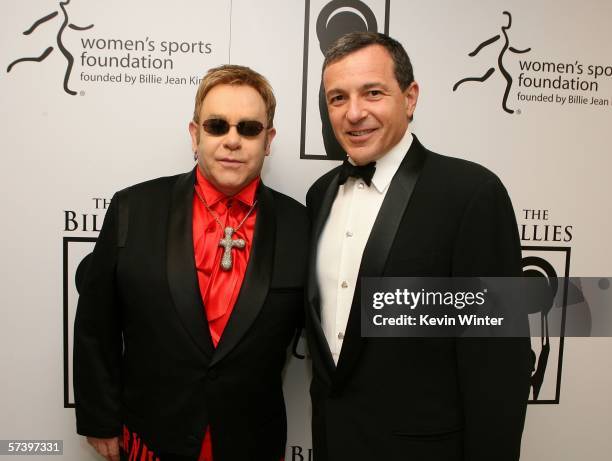 Sir Elton John and Walt Disney President and Chief Executive Officer Bob Iger pose backstage at the inaugural The Billies presented by The Women's...