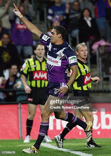 Greg Inglis of the Storm celebrates a try during the round seven NRL match between the Melbourne Storm and the Newcastle Knights held at Olympic Park...