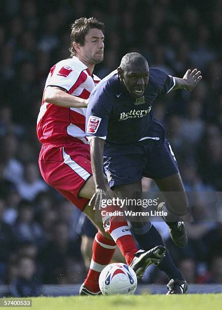 Shaun Goater of Southend United is tackled by Graeme Lee, captain of Doncaster Unitedduring the Coca-Cola League One match between Southend United...