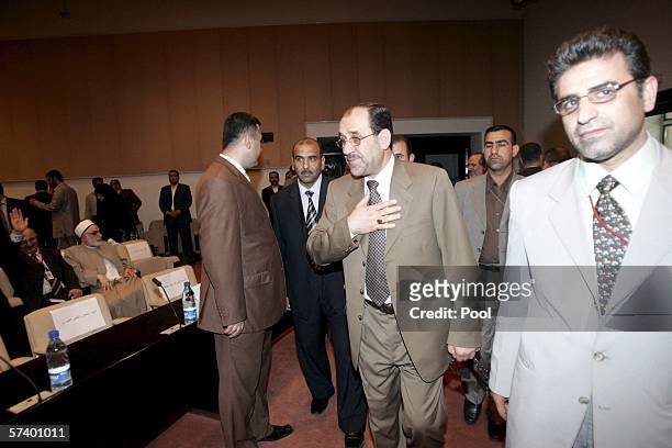 New Iraqi Prime Minister Jawad al-Maliki greets the members of the parliament during the second session of the parliament on April 22, 2006 in...