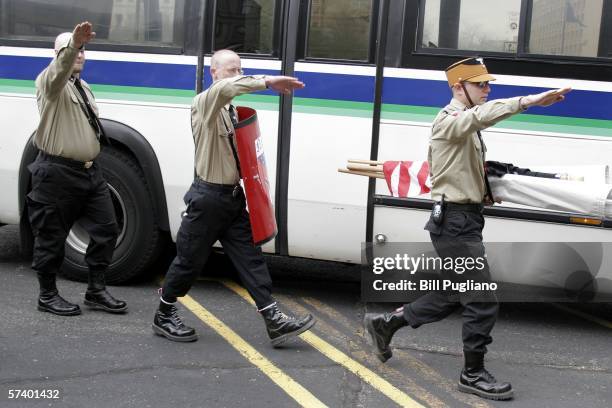 Neo-Nazis give a salute as they get off a bus and arrive at the Neo-Nazi rally in front of the Michigan State Capitol Building April 22, 2006 in...