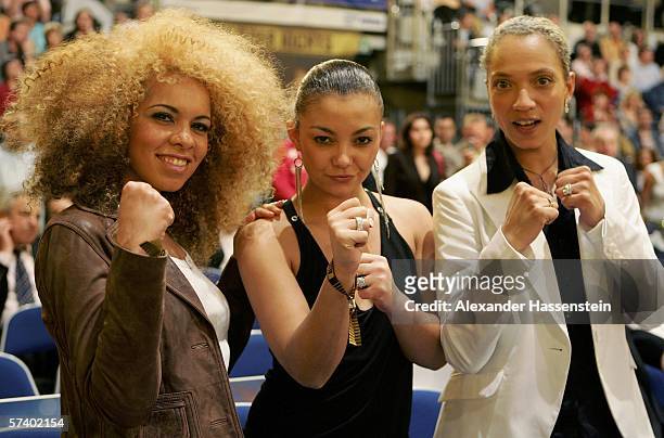 Ricky, Jazzy and Lee from the German Girl Group "Tic Tac Toe" pose during the IBF and vacant IBO World Haevyweight Championship fight between Chris...