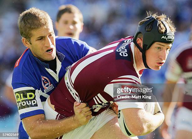 Steve Menzies of the Sea Eagles is tackled by Tony Grimaldi of the Bulldogs during the round seven NRL match between the Bulldogs and the...