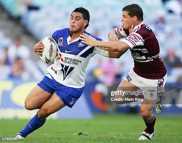 Reni Maitua of the Bulldogs fends off Anthony Watmough of the Sea Eagles during the round seven NRL match between the Bulldogs and the...