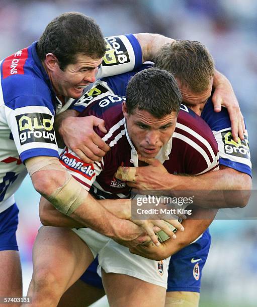 Anthony Watmough of the Sea Eagles is wrapped up by the Bulldogs defence during the round seven NRL match between the Bulldogs and the...