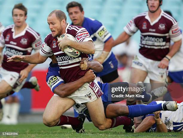 Steven Bell of the Sea Eagles is tackled by the Bulldogs defence during the round seven NRL match between the Bulldogs and the Manly-Warringah Sea...