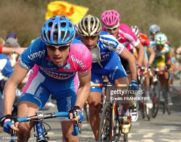 Italy's Damiano Cunego and compatriot Paolo Bettini ride in the leading pack during the 92th Liege-Bastogne-Liege cycling race between Liege and Ans,...