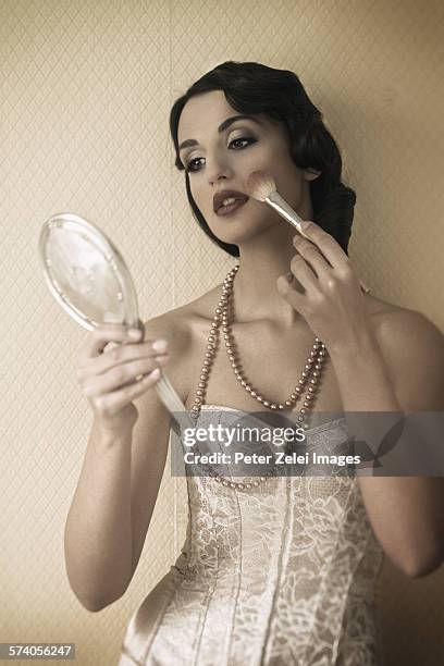 beautiful woman with hand mirror - vintage hand mirror stock pictures, royalty-free photos & images