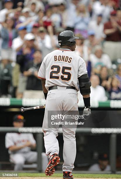 Barry Bonds of the San Francisco Giants walks back to the dugout after striking out as a pinch hitter in the ninth inning against the Colorado...