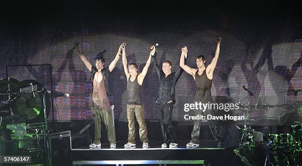 Singers , Gary Barlow, Howard Donald, Jason Orange and Mark Owen of Take That perform on stage at the band's opening night of their 'Ultimate Tour...