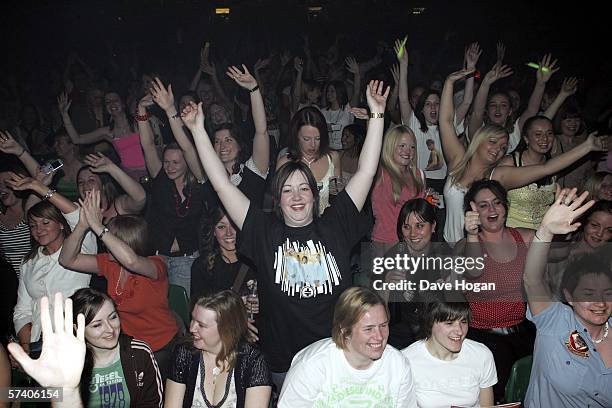 Fans of Take That are seen inside the venue for the band's opening night of their 'Ultimate Tour 2006' at Metro Radio Arena on April 23, 2006 in...