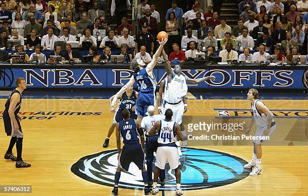 DeSagana Diop of the Dallas Mavericks takes the tip off against Pau Gasol of the Memphis Grizzlies in game one of the Western Conference...