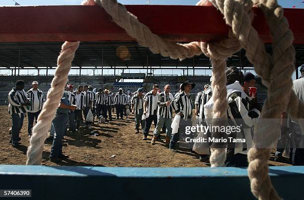 Inmate contestants depart the arena at the finish of the Angola Prison Rodeo at the Louisiana State Penitentiary April 23, 2006 in Angola, Louisiana....