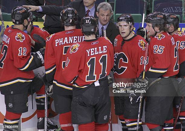 Head coach Darryl Sutter of the Calgary Flames instructs his players after calling a timeout in the remaining seconds of the third period against the...