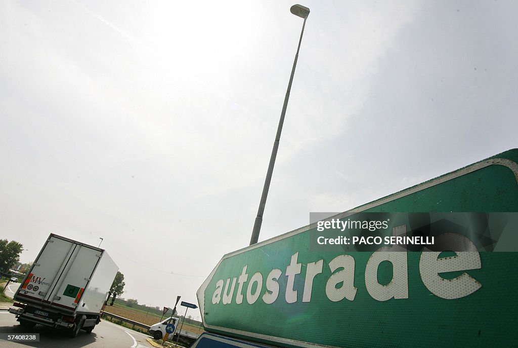 A truck enters in Milan on A1 highway in