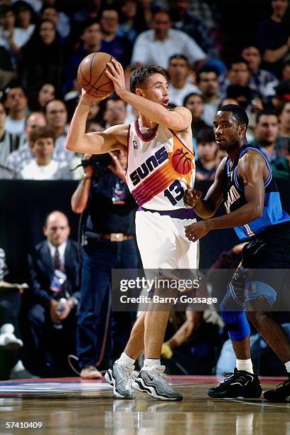 Steve Nash of the Phoenix Suns looks to pass against Terrell Brandon of the Cleveland Cavaliers during the 1996 Mexico City Challenge at the Palacio...