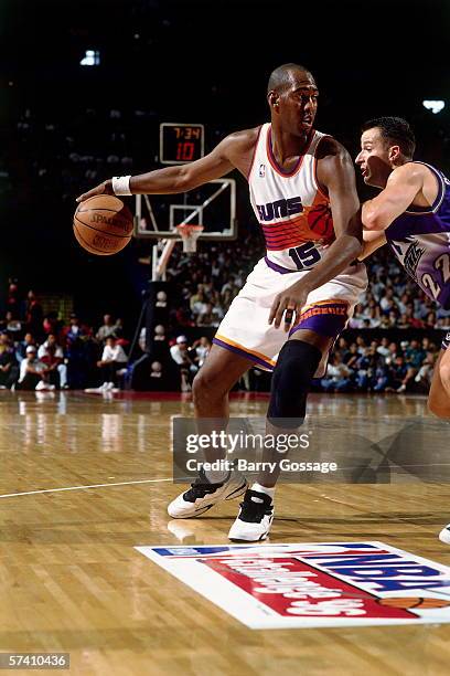 Danny Manning of the Phoenix Suns posts up against Brooks Thompson of the Utah Jazz during the 1996 Mexico City Challenge at the Palacio de los...