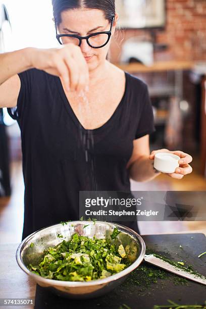 woman making a salad - salad bowl bildbanksfoton och bilder