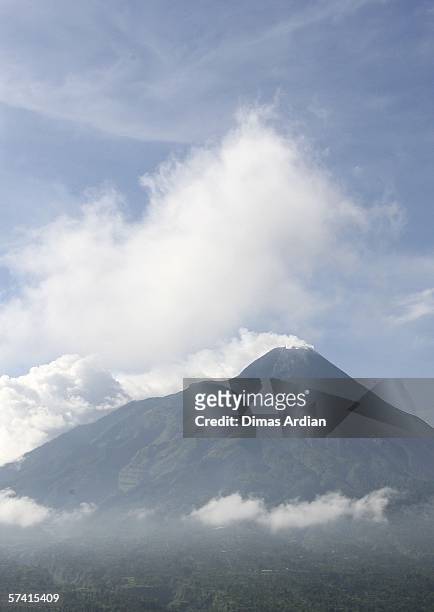 Mount Merapi spews smoke from its crater as seen from the village of Ketep April 25 in central Java province, 400km southeast of capital city...