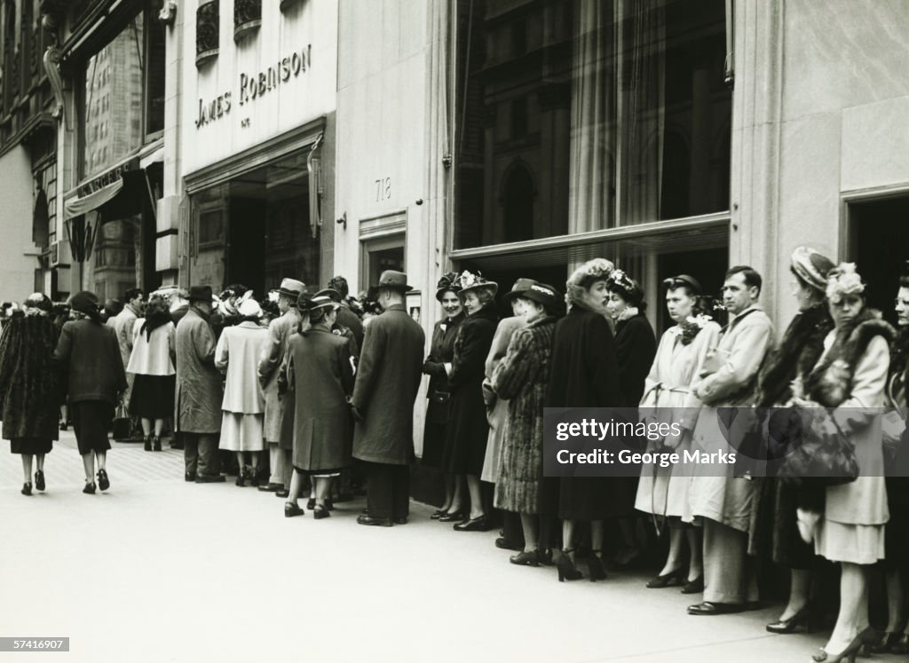 People standing in line at James Robinson cinema, NY, (B&W)