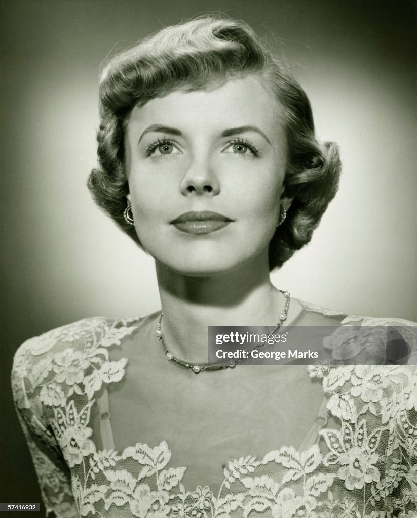 Woman wearing lace dress posing in studio, (B&W), (Close-up), (Portrait)